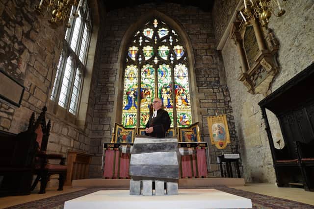 Sheffield Cathedral's Vice Dean and Canon Missioner, The Reverend Canon Keith Farrow, with one of the exhibits at a new exhibition, The Foundry, which celebrates the South Yorkshire city's long history of steel-making. (Picture: Jonathan Gawthorpe)