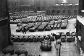 3rd December 1934:  Hundreds of barrels of wine laid out for inspection before being transferred to vaults and warehouses at the Wine Crescent, London Docks.  (Photo by Fox Photos/Getty Images)