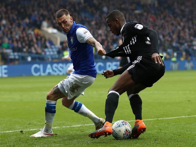 RETURNING: Jack Hunt tackles Ryan Sessegnon in his first spell as a Sheffield Wednesday player