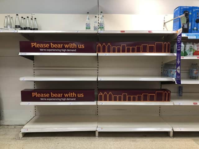 Empty shelves and signs on the soft drinks aisle of a Sainsbury's store in Blackheath, Rowley Regis in the West Midlands. (PA/Matthew Cooper)
