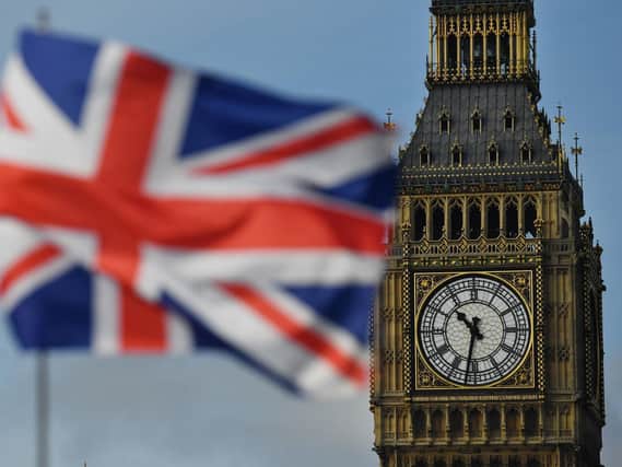 A Union flag flies near the Elizabeth Tower, better known as "Big Ben". Photo: BEN STANSALL/AFP via Getty Images.
