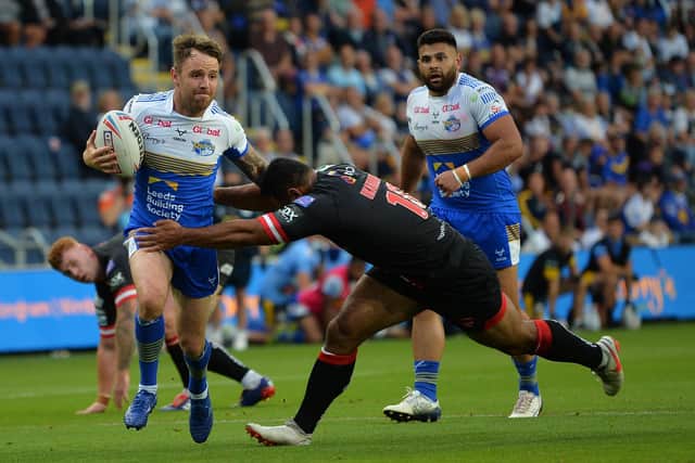 Leeds Rhinos Richie Myler makes a break to set up Kruise Leeming for his second try  Picture : Jonathan Gawthorpe