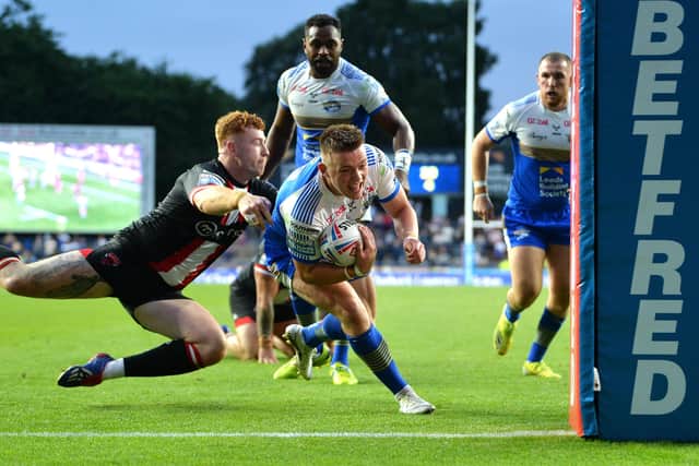 Leeds Rhinos' Callum Mclelland goes over to score against Salford Red Devils. 
Picture : Jonathan Gawthorpe