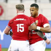 Put it there: Lions’ Stuart Hogg and Anthony Watson at the end of Saturday’s First Test. Picture: Steve Haag/PA Wire.
