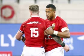 Put it there: Lions’ Stuart Hogg and Anthony Watson at the end of Saturday’s First Test. Picture: Steve Haag/PA Wire.