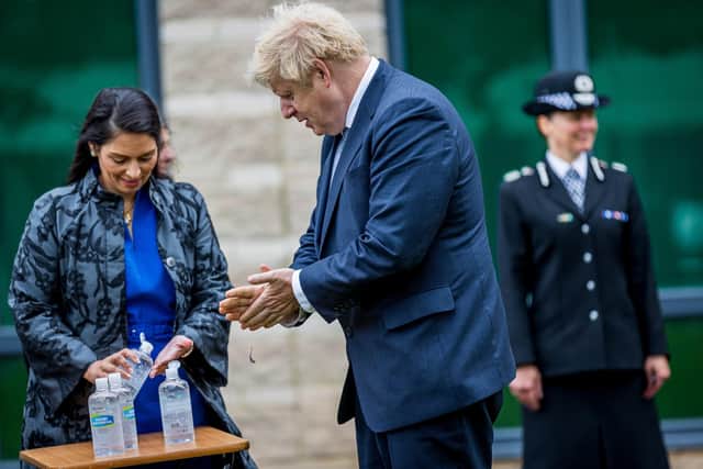 Boris Johnson and Priti Patel during a visit to North Yorkshire police's HQ last summer. Photo: Charlotte Graham.