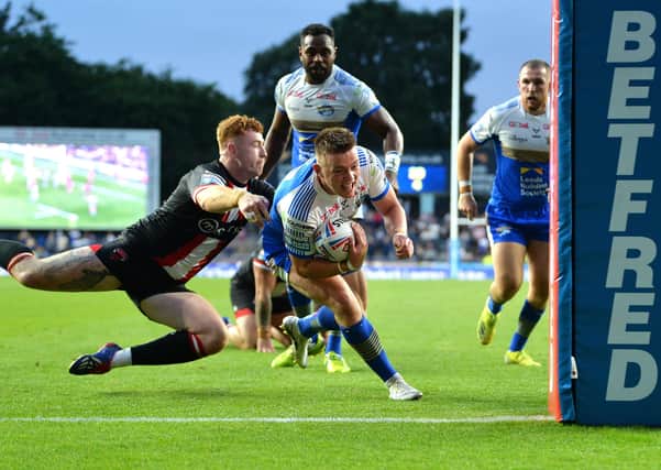 Callum McLelland goes over to score his first Super League try for Leeds Rhinos against Salford Red Devils on Friday. 
Picture: Jonathan Gawthorpe.