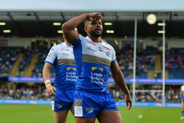 Leeds Rhinos' Kruise Leeming salutes the crowd after scoring his second try against Salford Red Devils on Friday. Picture: Jonathan Gawthorpe.