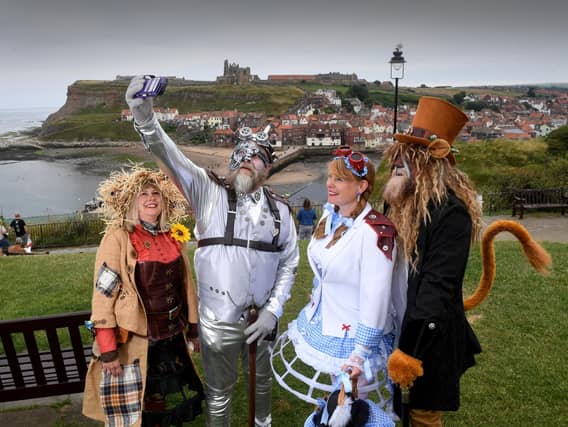 A group in Wizard of Oz-themed outfits