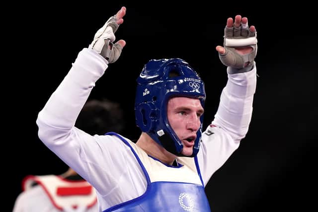 Great Britain's Bradly Sinden celebrates victory against China's Shuai Zhao in the Men 68kg Semifinal match at Makuhari Messe Hall A on the second day of the Tokyo 2020 Olympic Games in Japan.