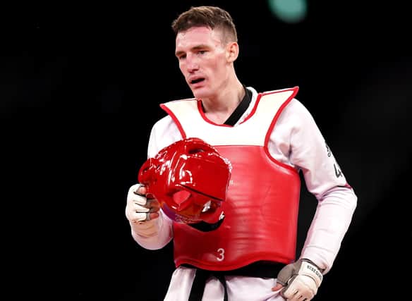 Great Britain's Bradly Sinden appears dejected after getting silver in the Men's 68kg Gold Medal Contest against Uzbekistan's Ulugbek Rashitov at Makuhari Messe Hall A on the second day of the Tokyo 2020 Olympic Games in Japan.