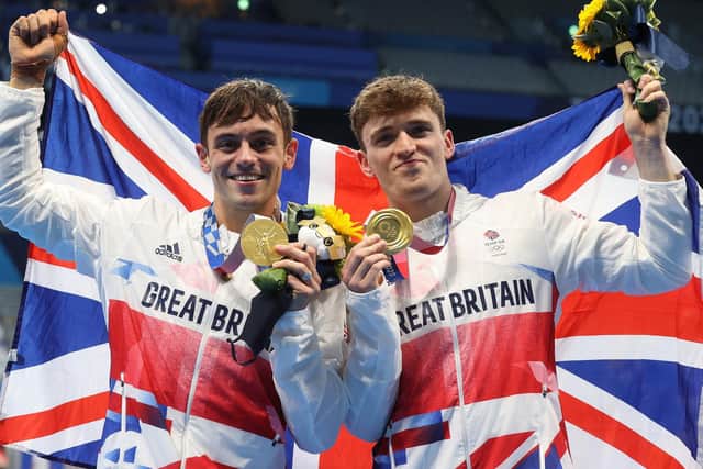 GOLDEN BOYS: Tom Daley and Matty Lee with their gold medals. Picture: Getty Images.