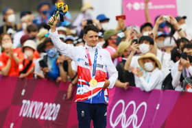 Tom Pidcock poses with the gold medal after the Men's Cross-country race at Izu Mountain Bike Course. (Photo by Tim de Waele/Getty Images)