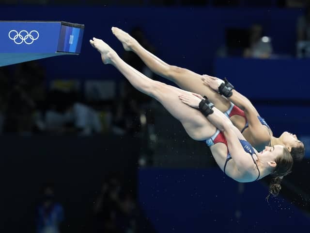 In unison: Eden Cheng and Lois Toulson of Britain compete during the women's synchronized 10m platform diving final.