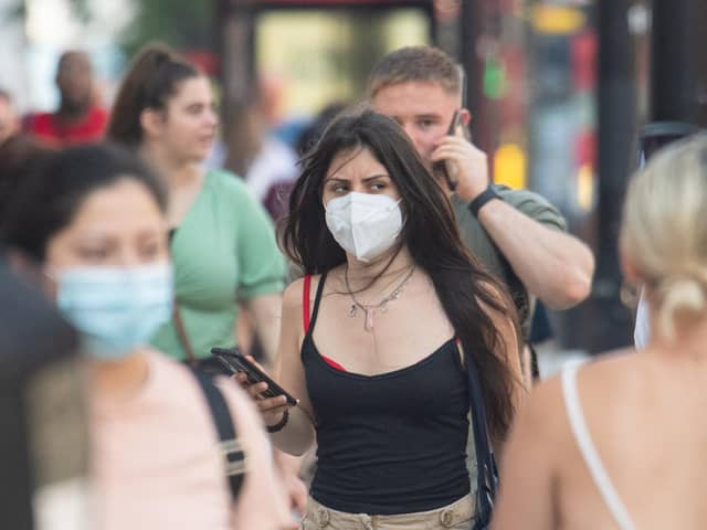 People pictured in facemasks, July 19 2021 (Dominic Lipinski/PA)