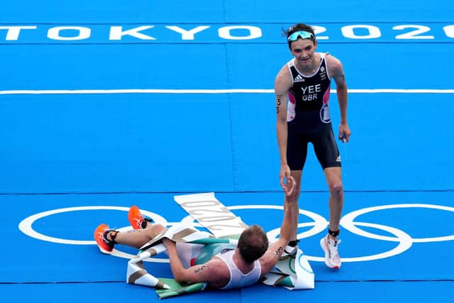 Great Britain's Alex Yee finishes second in the men's Triathlon at the Odaiba Marine Park, Norway's Kristian Blummenfelt (pictured on the floor) taking the gold medal.  Picture: Martin Rickett/PA
