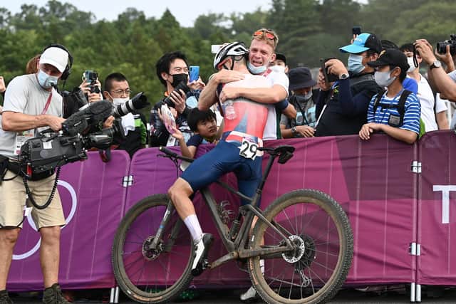 Tom Pidcock celebrates with his coach Kurt Bogaerts after winning the men's cross-country race and being crowned Olympic Champion. Picture by Alex Broadway/SWpix.com -