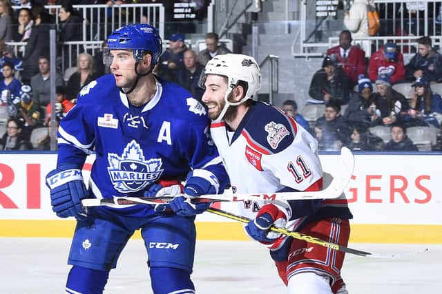 Travis Oleksuk, right, in action for the Hartford Wolf Pack during an AHL clash with the Toronto Marlies in April 2016. Picture: Graig Abel/Getty Images