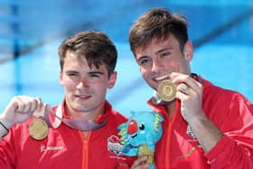 Dan Goodfellow (left) holding a gold medal with Tom Daley (right). (Pic credit: Danny Lawson / PA)