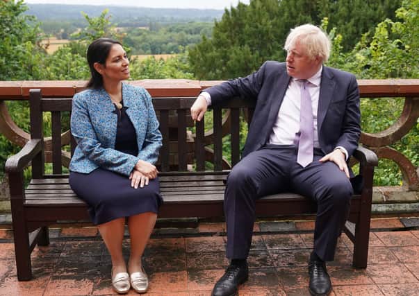Prime Minister Boris Johnson and Home Secretary Priti Patel speak to cadets during a visit to Surrey Police headquarters in Guildford, Surrey, to coincide with the publication of the Government's Beating Crime Plan.