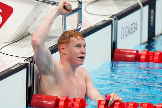 Great Britain's Tom Dean celebrates winning the Men's 200m Freestyle at Tokyo Aquatics Centre on the fourth day of the Tokyo 2020 Olympic Games in Japan.