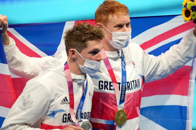 Great Britain's Tom Dean (right) with his gold medal celebrates after winning the Men's 200m Freestyle alongside second placed silver medalist Great Britain's Duncan Scott at Tokyo Aquatics Centre on the fourth day of the Tokyo 2020 Olympic Games in Japan.