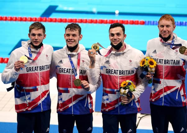 Great Britain's Duncan Scott, Tom Dean, Matthew Richards and James Guy celebrate gold in the Men's 4x200 freestyle relay at Tokyo Aquatics Centre on the fifth day of the Tokyo 2020 Olympic Games in Japan.