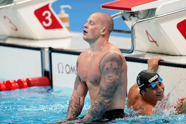Great Britain's Adam Peaty reacts after winning the Men's 100m Breaststroke final at the Tokyo Aquatics Centre on the third day of the Tokyo 2020 Olympic Games in Japan.