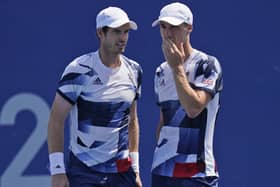 HEADING OUT: Joe Salisbury, right, and Andy Murray talk during their men's doubles quarter-finals match in Tokyo. Picture: AP/Seth Wenig