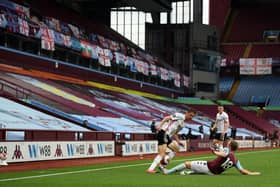 EMPTY TERRACES: Sheffield United play Aston Villa in England's first football match since the spring 2020 Covid-19 lockdown. The lack of supporters did huge damage to football's finances
