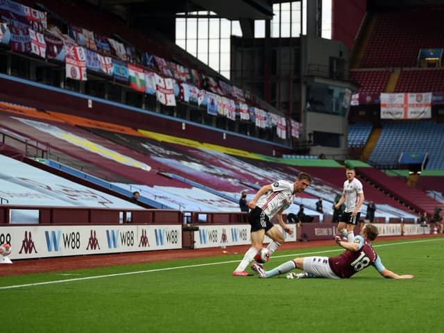 EMPTY TERRACES: Sheffield United play Aston Villa in England's first football match since the spring 2020 Covid-19 lockdown. The lack of supporters did huge damage to football's finances