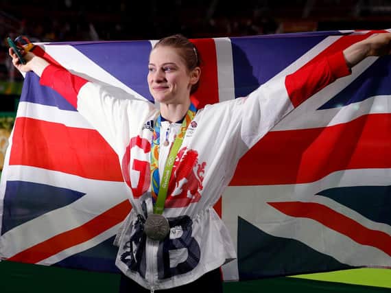 Bryony Page waving the GB flag at the Rio Olympics. (Pic credit: Owen Humphreys / PA Wire)