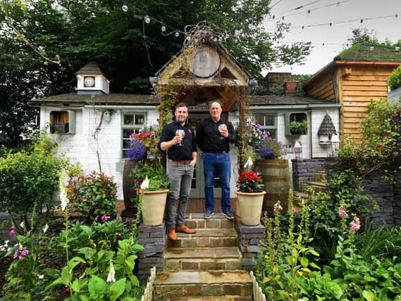 Peter Speight and head distiller Daniel Shepherd outside their garden distillery