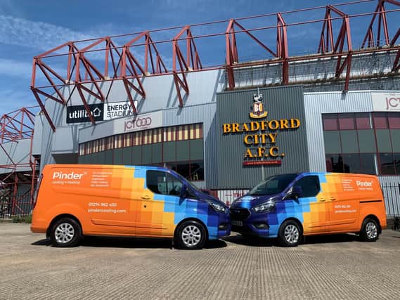 Appointment: Pinder vans outside Bradford Citys stadium, where the firm has been appointed to carry out work.