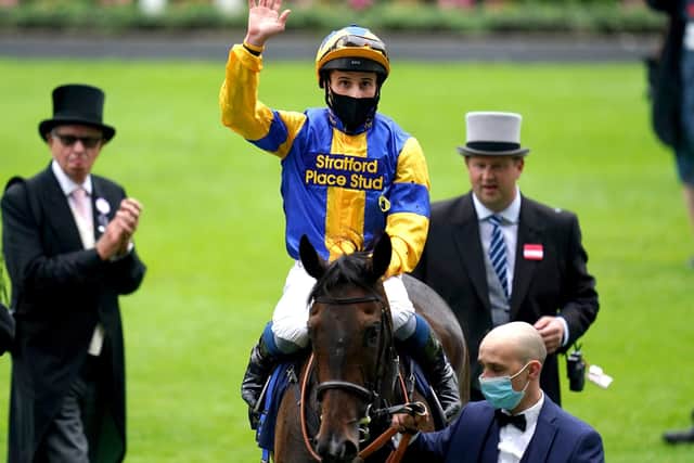 Jockey William Buick waves to the crowd after winning The Hardwicke Stakes on Wonderful Tonight during day five of Royal Ascot.