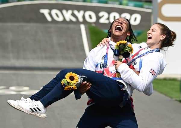Bethany Shriever (Gold) is lifted by Kye Whyte (Silver) of Great Britain after both winning Olympic medals in their Olympic finals (Picture: Alex Broadway/SWpix.com)