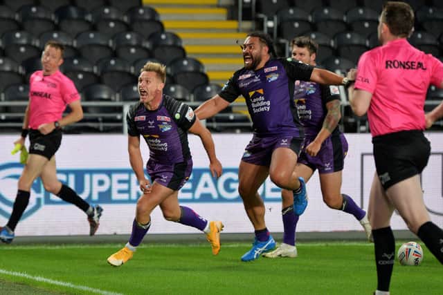 Leeds Rhinos' Brad Dwyer celebrates scoring his side's first try against Hull FC on Thursday night. Picture: Jonathan Gawthorpe.