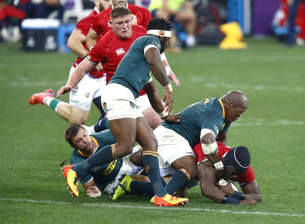 British and Irish Lions' Maro Itoje (right) is tackled by South Africa during a tough day in Cape Town. Picture: Steve Haag/PA