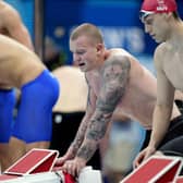 Britain's Adam Peaty, left, and James Guy look on after their team finished second in the mixed 4x100-meter medley relay. Picture: AP/David Goldman