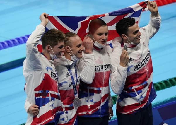 Silver lining: Britain's men's 4x100-meter medley relay team, Luke Greenbank, Adam Peaty, James Guy and Duncan Scott   after winning silver. Picture: AP Photo/Jae C Hong
