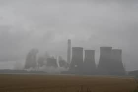 Four of the eight cooling towers at the former coal-fired Eggborough Power Station are demolished
