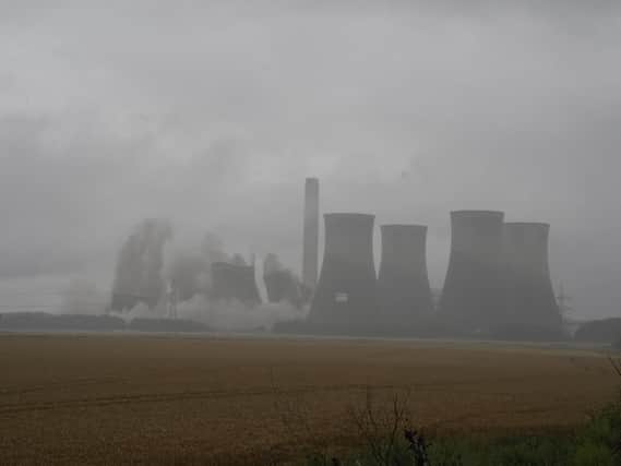 Four of the eight cooling towers at the former coal-fired Eggborough Power Station are demolished