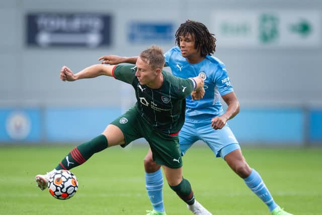 BATTLING: Cauley Woodrow shields the ball from Nathan Ake during Saturday's pre-season meeting. Pictures: Getty Images.