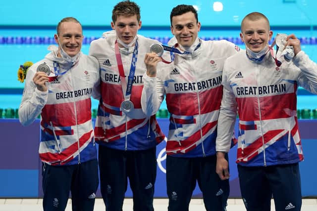 SILVER LINING: Luke Greenbank, left, Duncan Scott, James Guy and Adam Peaty, right, after the men’s 4 x 100m medley relay. Picture: PA