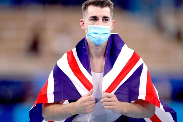 Flying the flag: Great Britain's Max Whitlock celebrates after winning gold.