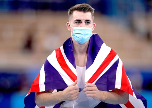 Flying the flag: Great Britain's Max Whitlock celebrates after winning gold.