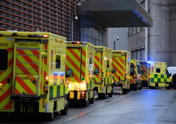 Ambulances queue outside a A&E unit earlier this year.