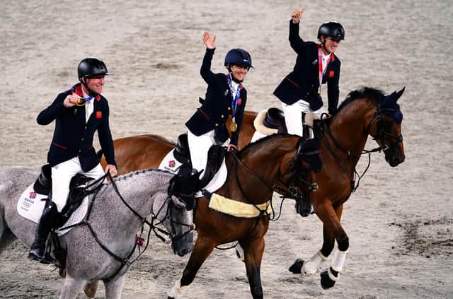 Great Britain's Laura Collett, Tom McEwen and Oliver Townend with their gold medals for the Eventing Jumping Team Final during the Eventing Jumping Team Final.