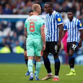 AIMING HIGH: Huddersfield Town’s Lewis O’Brien, left, has a few words with Sheffield Wednesday’s Dennis Adeniran during Sunday’s Carabao Cup clash at Hillsborough. Picture: Robbie Jay Barratt/Getty Images