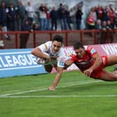Catalans Dragons' Romain Franco scores a try despite the attentions of KR's Ryan Hall (Picture: John Clifton/SWpix.com)